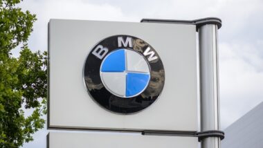 the logo of the brand "BMW" at a new car dealer building