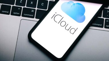 Close up of iCloud logo displayed on a smartphone screen, representing the Apple class action.