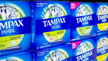 Tampax products on a supermarket shelf, representing the Tampax class action.