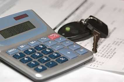 Car Keys and Calculator on Auto Loan Application
