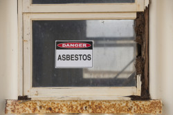 Asbestos danger sign warning on building