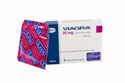 Viagra pills tablets isolated on white background studio shot with durex condom