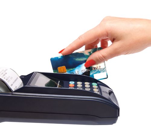 transaction - women hand with credit card in payment terminal