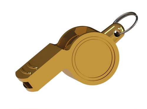 golden whistle isolated on white background