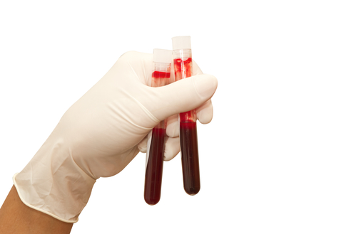 Doctor hand with blood test tubes Isolated on White with path