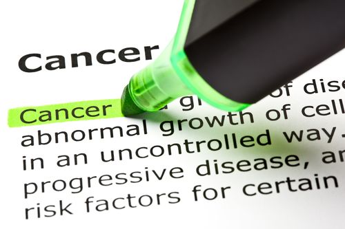 The word 'Cancer' highlighted in green with felt tip pen