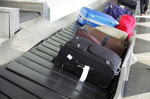 Suitcases on a luggage band on the airport
