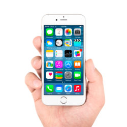 White Apple iPhone 6 displaying homescreen