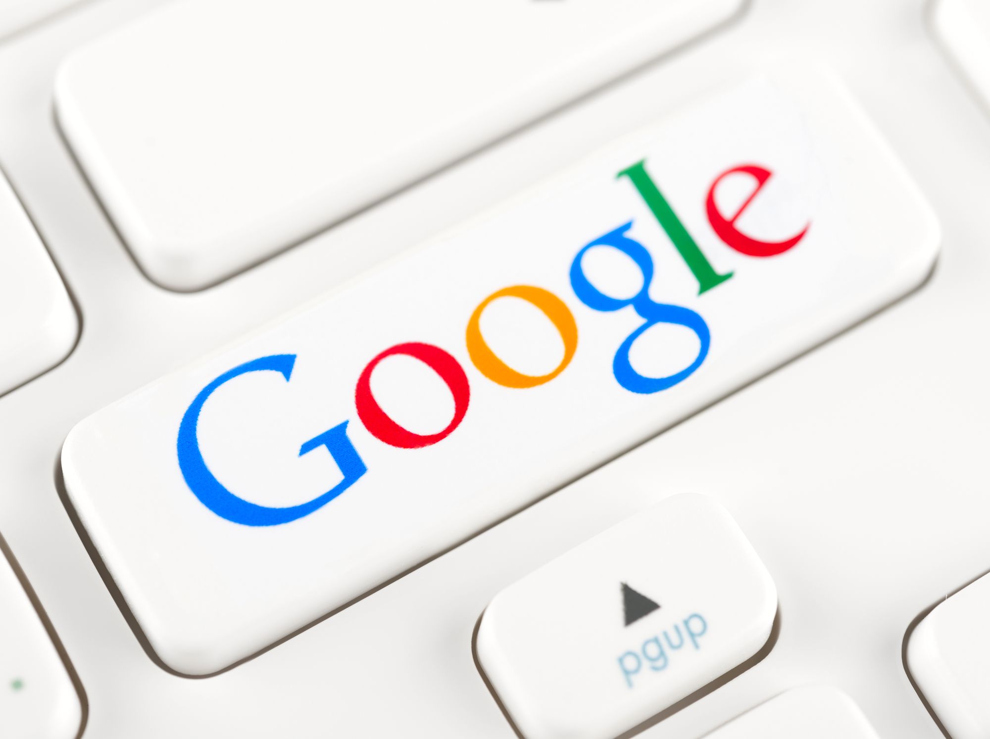 SIMFEROPOL, RUSSIA - NOVEMBER 22, 2014: Photo shoot of Google logotype on a keyboard button. Google is an American multinational corporation specializing in Internet-related services and products