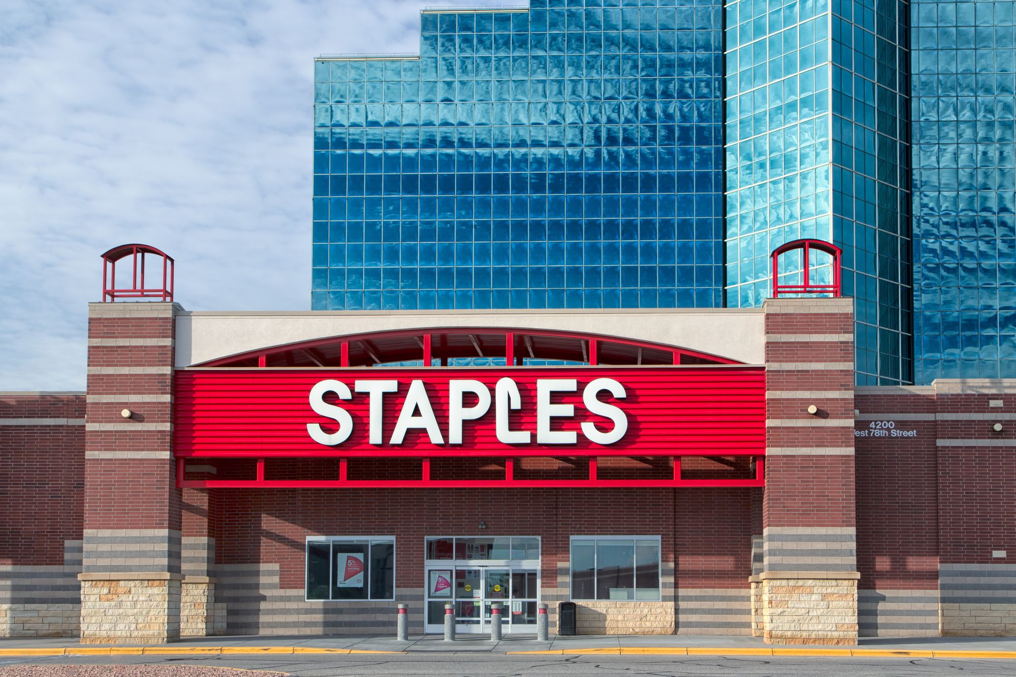 BLOOMINGTON, MN/USA - JUNE 22, 2014: Staples office supply store exterior. Staples, Inc. sells supplies, office machines, promotional products, furniture, technology, and business services in stores and online.