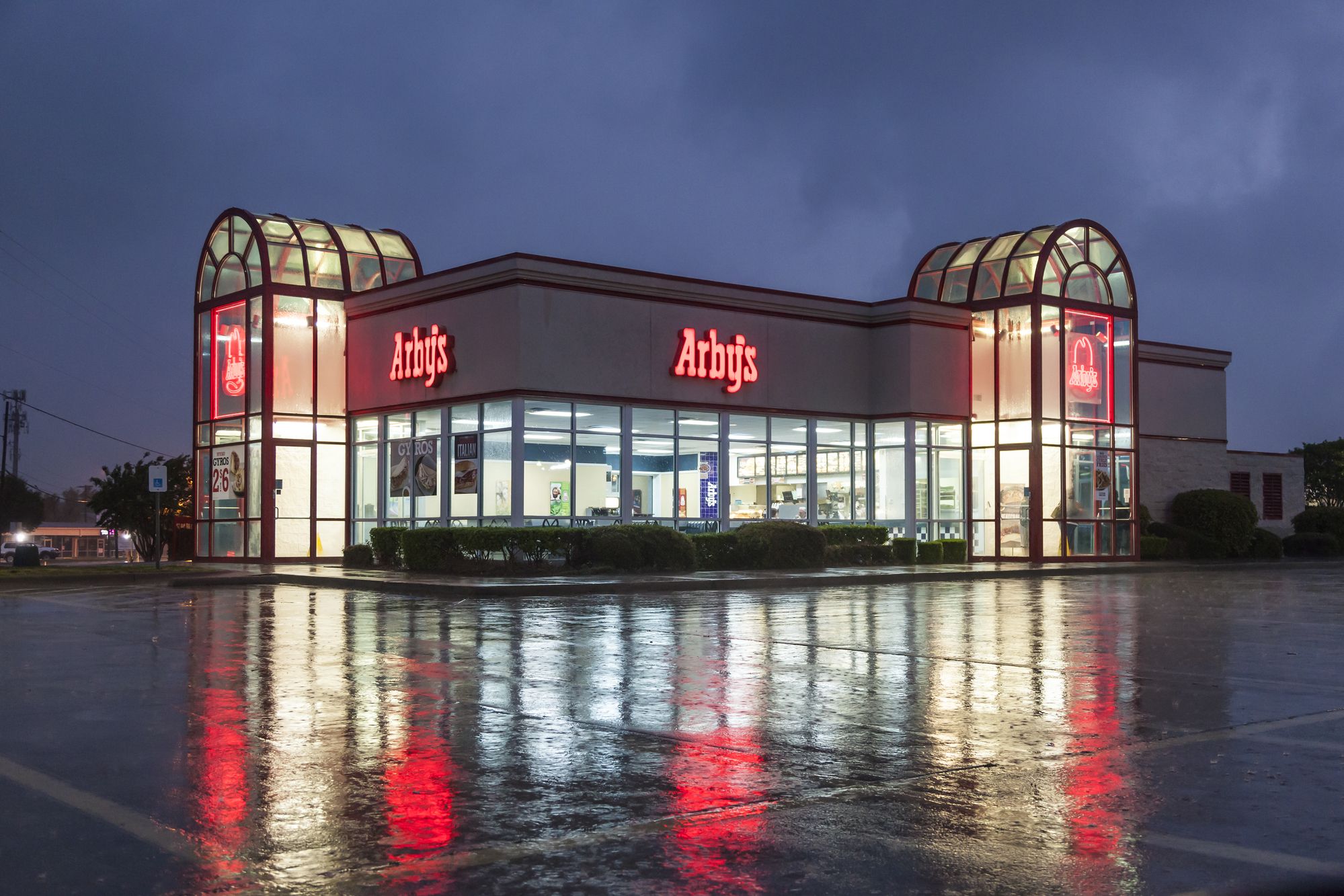 DALLAS, Tx, USA - APR 17, 2016: Arby's restaurant building illuminated at night. Arby's is the second largest sandwich chain in the U.S. with more than 3,400 restaurants