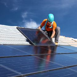 Man installing solar panels energy deregulation