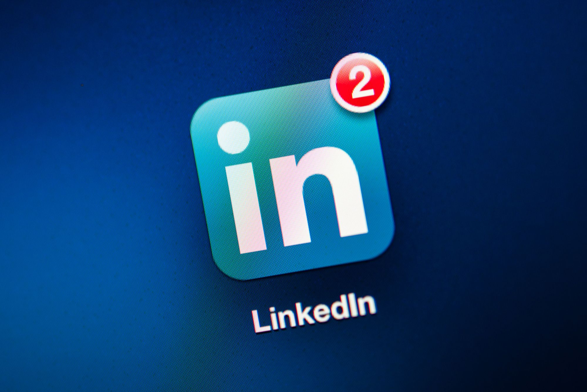 NEW YORK - NOVEMBER 13: Photo of LinkedIn Icon on a mobile tablet. Four LinkedIn users have filed a lawsuit accusing the business-oriented social network of accessing their e-mail accounts without permission, harvesting the addresses of their contacts and spamming those people with repeated invitations to join the service. November 13, 2013