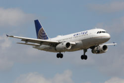 Miami, Florida - April 10, 2014: A United Airlines Airbus A319 with the registration N805UA on approach to Miami Airport (MIA) in Florida. United Airlines is the world's largest airline with 695 planes and some 92 million passengers in 2012. It is headquartered in Chicago, Illinois.