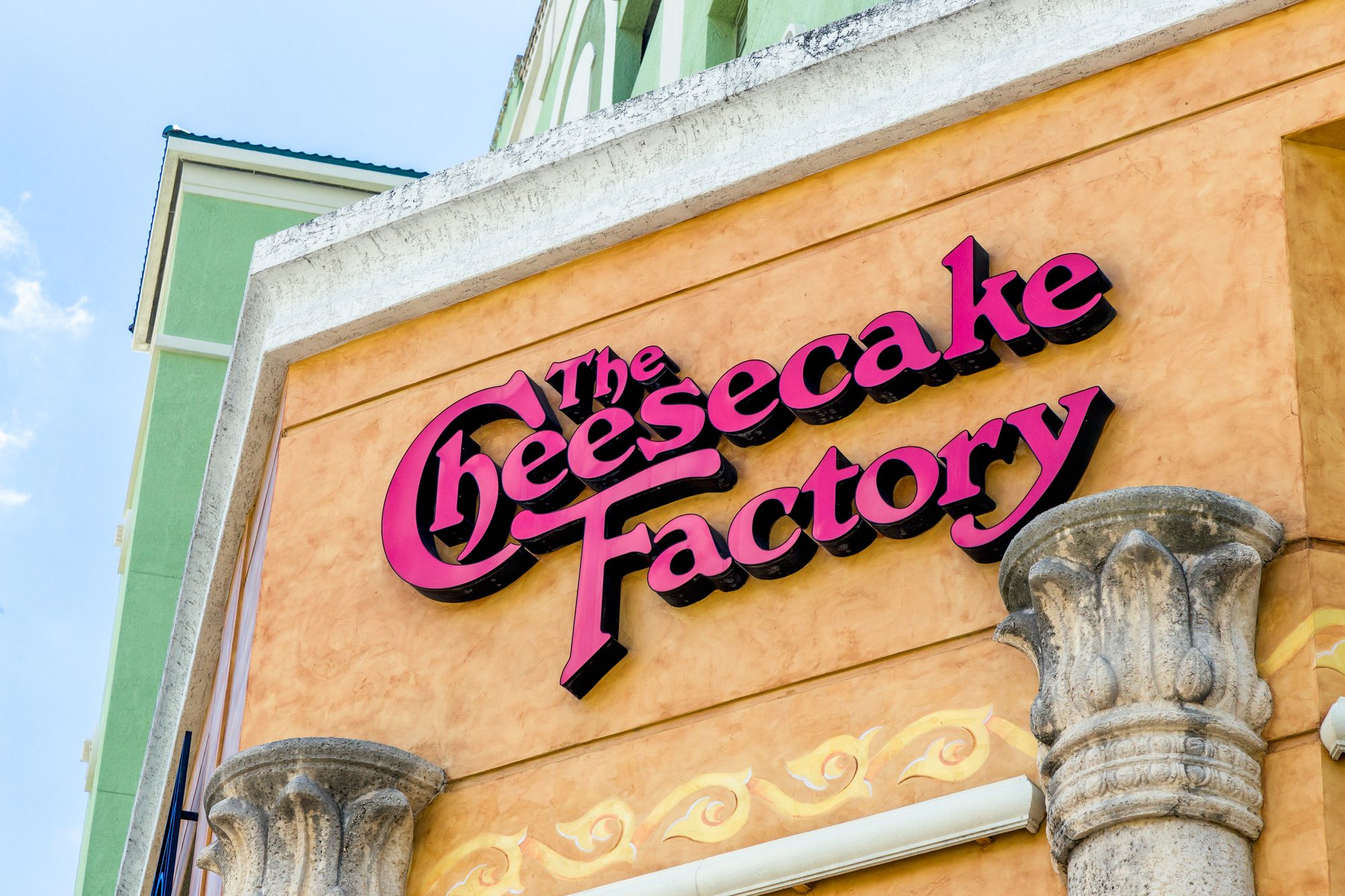 FORT LAUDERDALE, FLA/USA - APRIL 10, 2017: The Cheesecake Factory exterior sign and logo. The Cheesecake Factory, Inc. is a restaurant company and distributor of cheesecakes based in the United States.