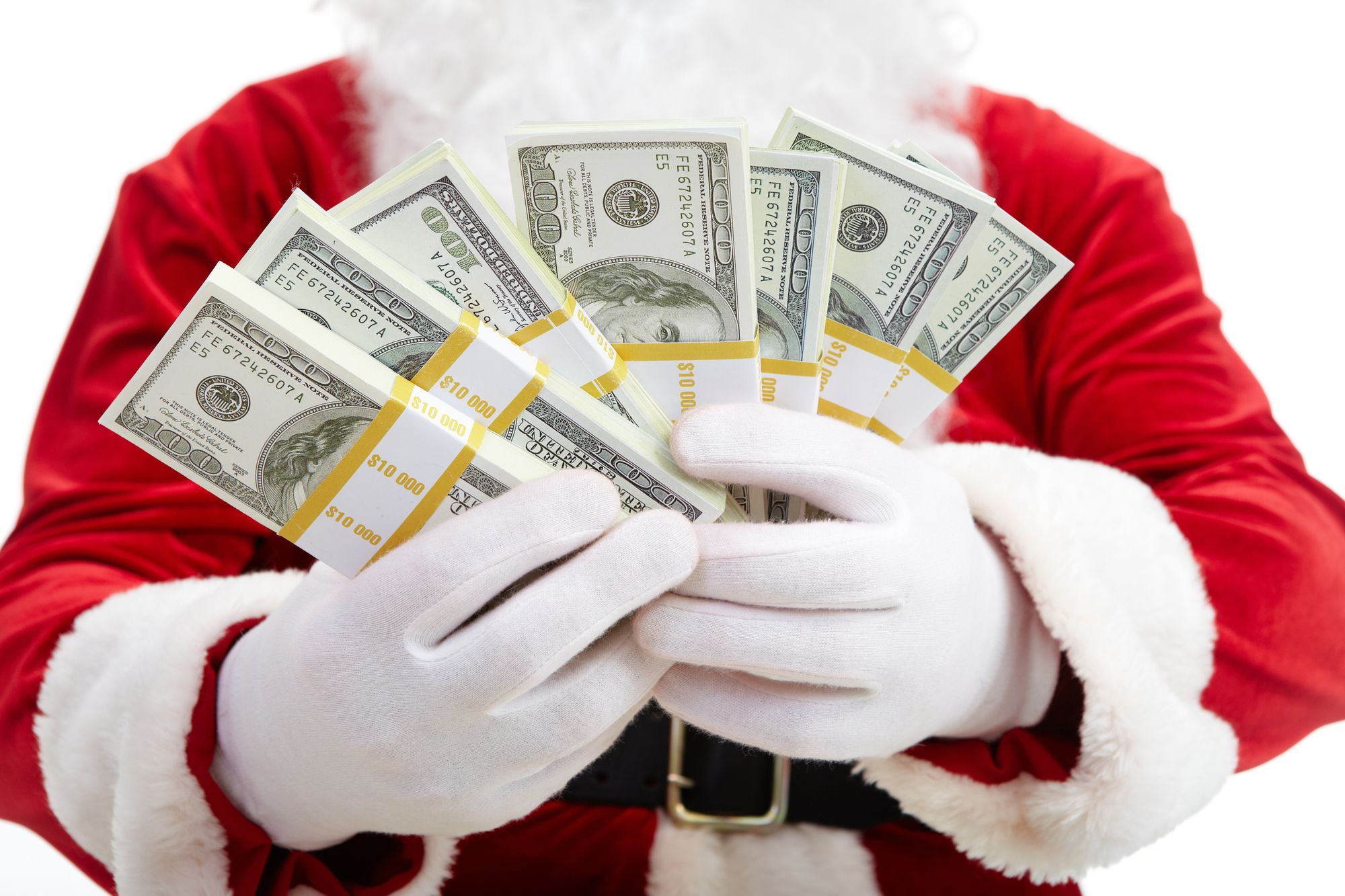 Close-up of Santa’s hands with stacks of dollar banknotes