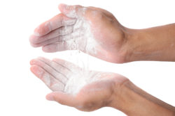 detail of powder in hand on white background, Body powder, ingredient of food