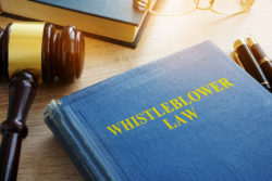 Whistleblower law on a court desk.