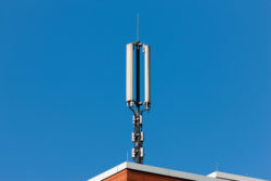 Mobile phone tower on the roof of a house