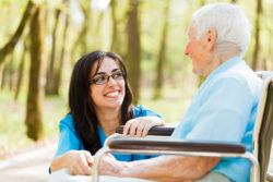 Home Helpers in home elder care nurse with patient in wheelchair