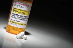 Prescription hydrocodone pills illustrating opioid overdose death epidemic