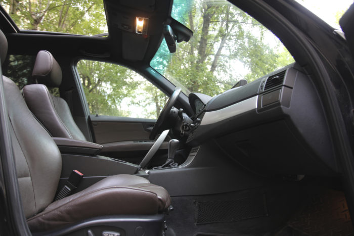 vehicle side view of seats and sunroof