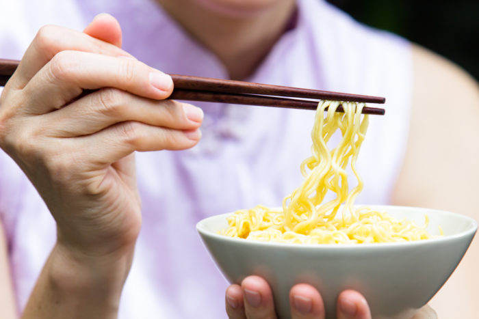 ramen noodles in bowl with chopsticks
