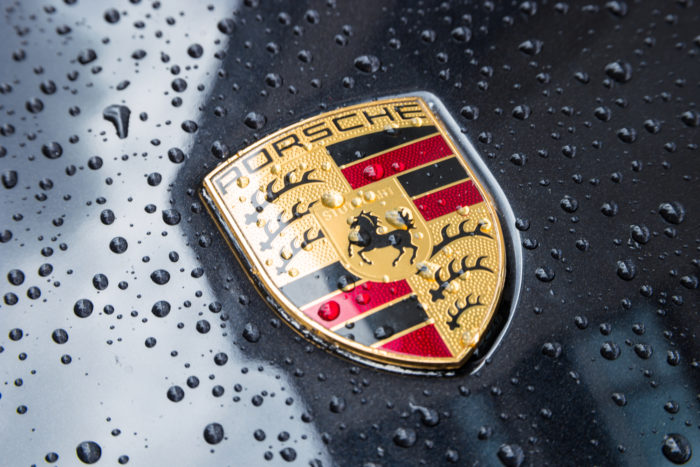 Porsche logo on a black vehicle