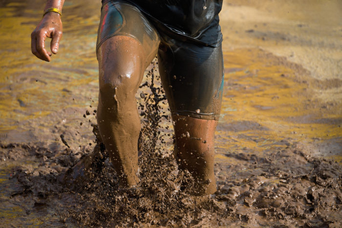 runner participating in Tough Mudder race