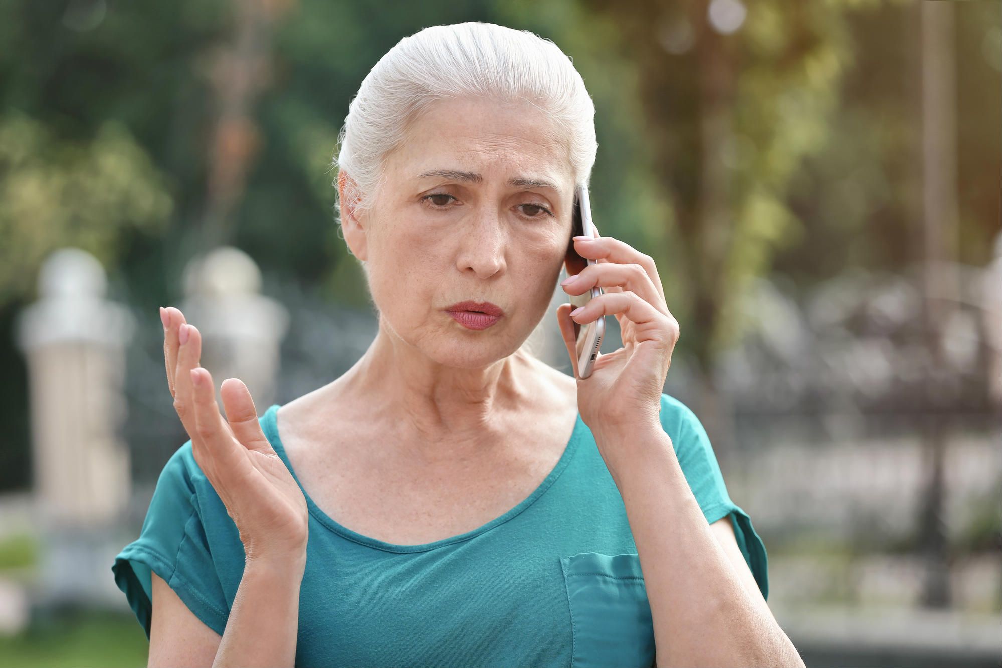 A woman is annoyed by a phone call