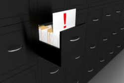 black file cabinet, document with red exclamation point