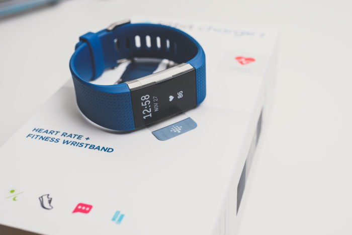 fitbit charge 2 fitness band on top of packaging