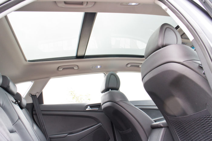 interior of a Hyundai Tucson vehicle with a view of the sunroof