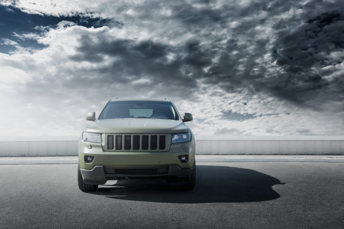 jeep grand cherokee manufactured by Fiat Chrysler with clouds in the background