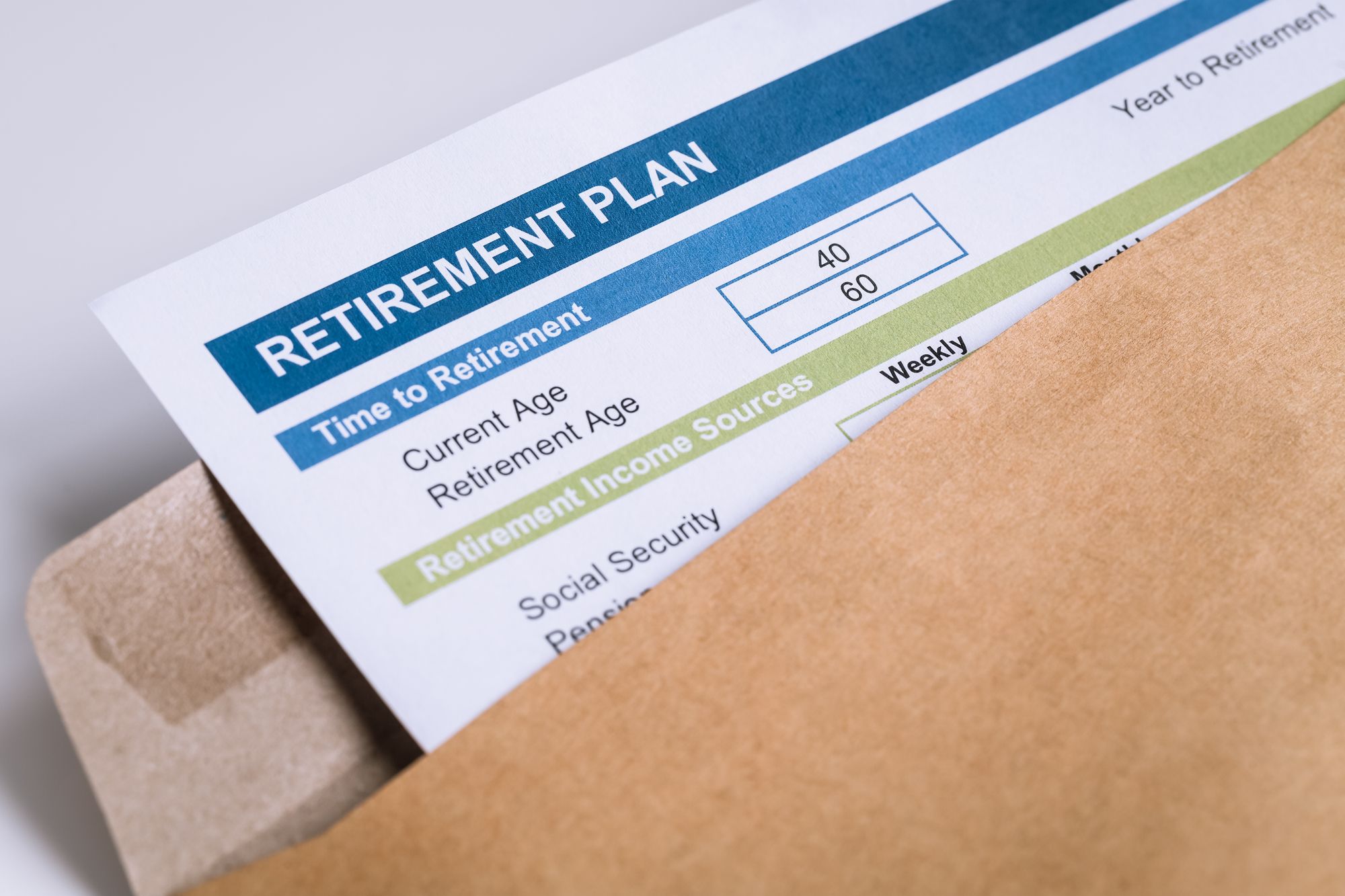 Retirement Planning letter in brown envelope opening, business concept - cerner