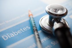 stethoscope and needle on diabetes test