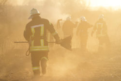 Firefighters work on a wildfire.