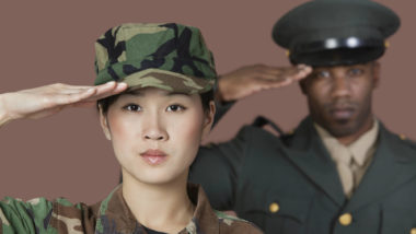 Female and male soldiers saluting