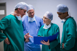 Surgeons discussing a file