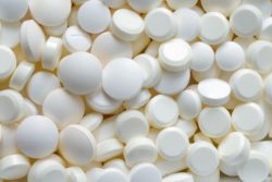 White pills in pile