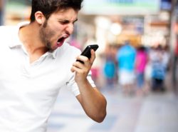 Angry young man on a cell phone
