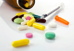 Diabetes drugs and insulin syringe