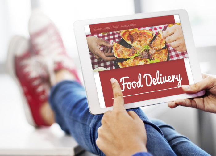 consumer ordering food delivery through DoorDash app