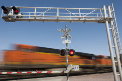 Train speeding through railroad crossing