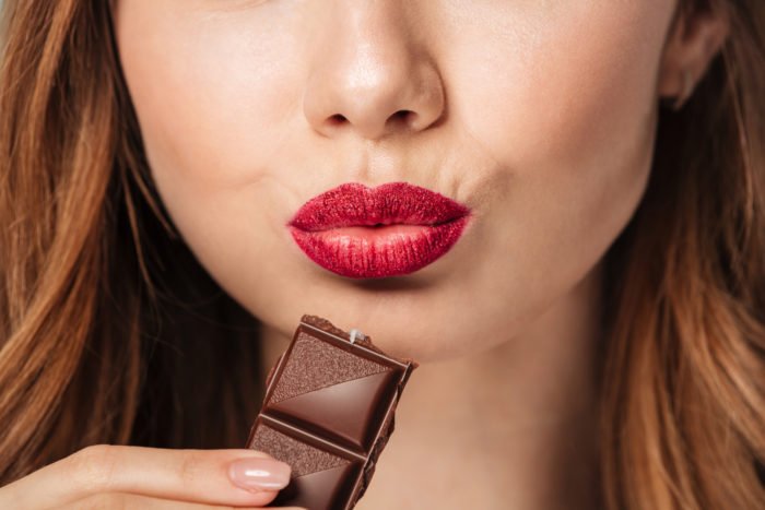 woman eating nestle brand chocolate