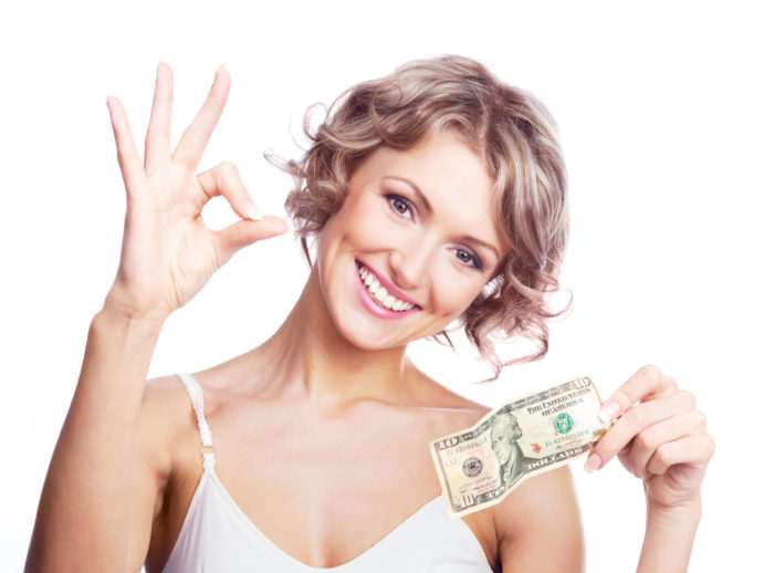 woman holding settlement money
