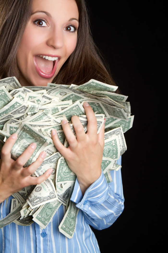 woman holding settlement cash money