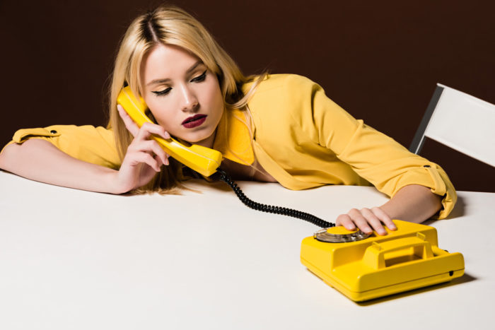 woman getting telemarketing call from all web leads