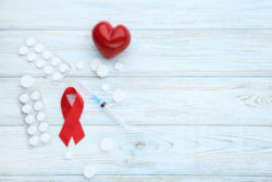 Aids ribbon with prescription pills