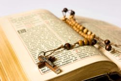 Bible with rosary beads